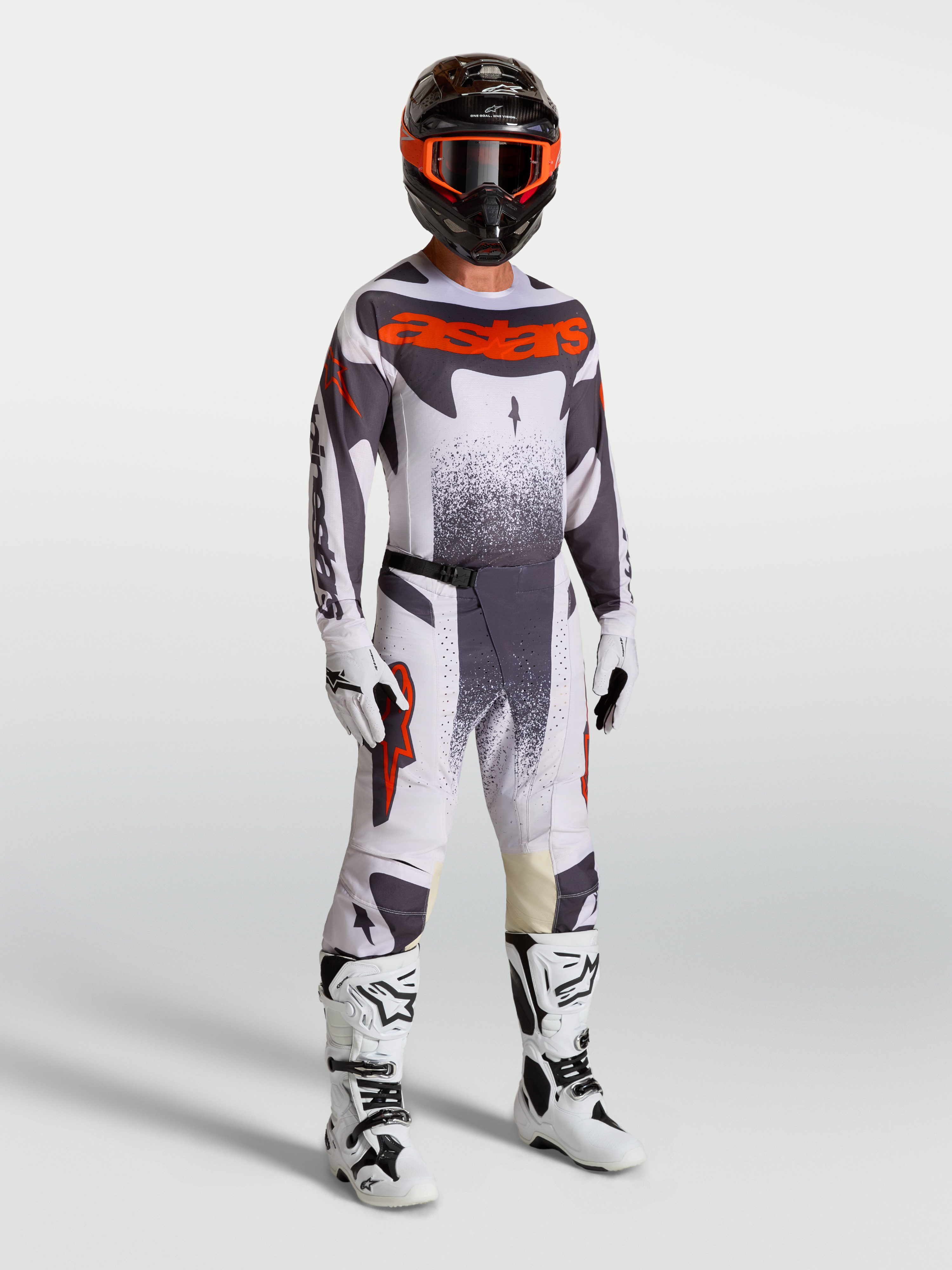Alpinestars Techstar Swan Motocross Gear Set, men's racing pants and jersey in Light Lilac and Red Fluo with white boots.