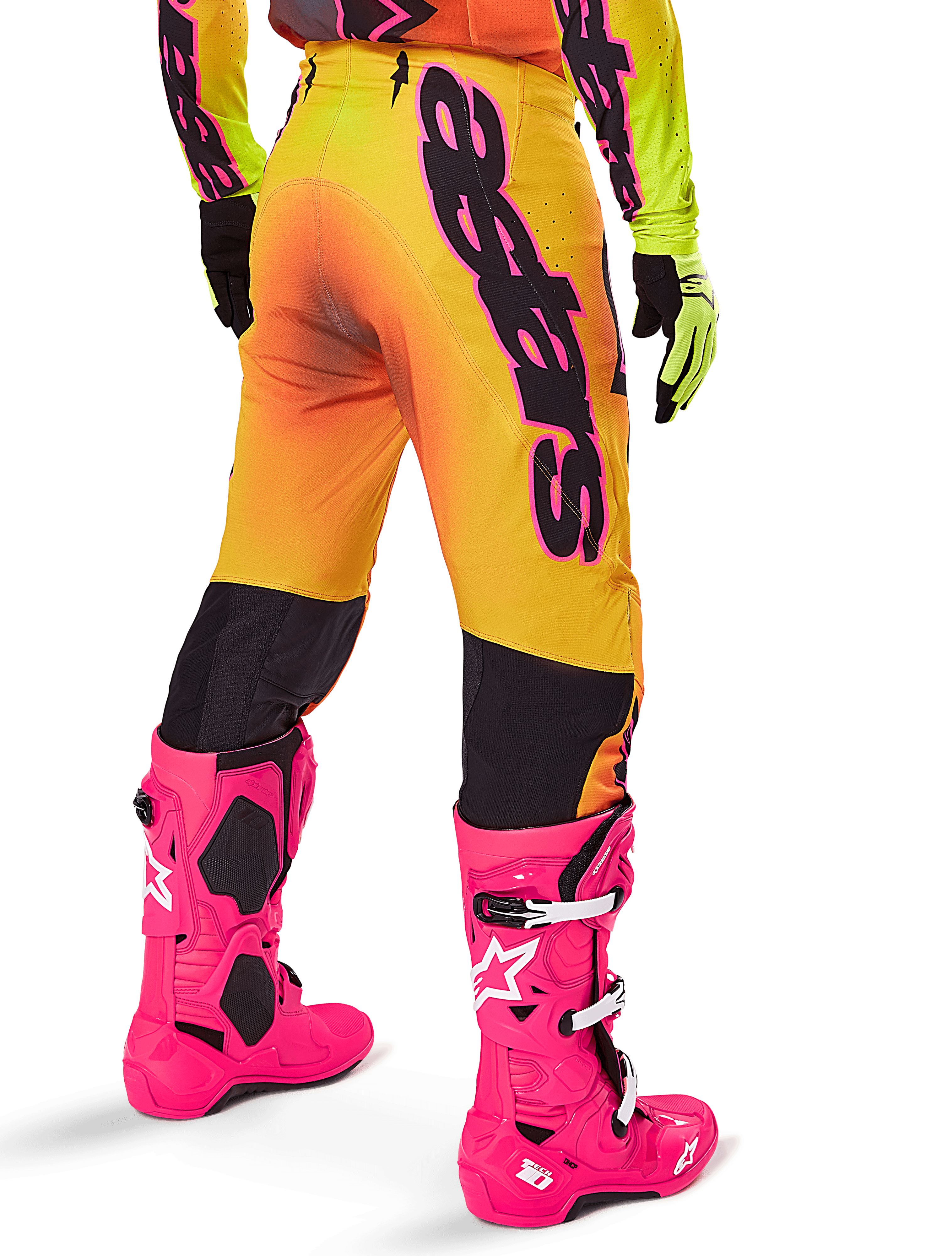 Alpinestars 2025 Supertech Lipan Gear Set, Rear view of yellow and orange gradient motocross pants with bold black branding, paired with bright pink Tech 10 boots and yellow gloves, professional off-road racing equipment