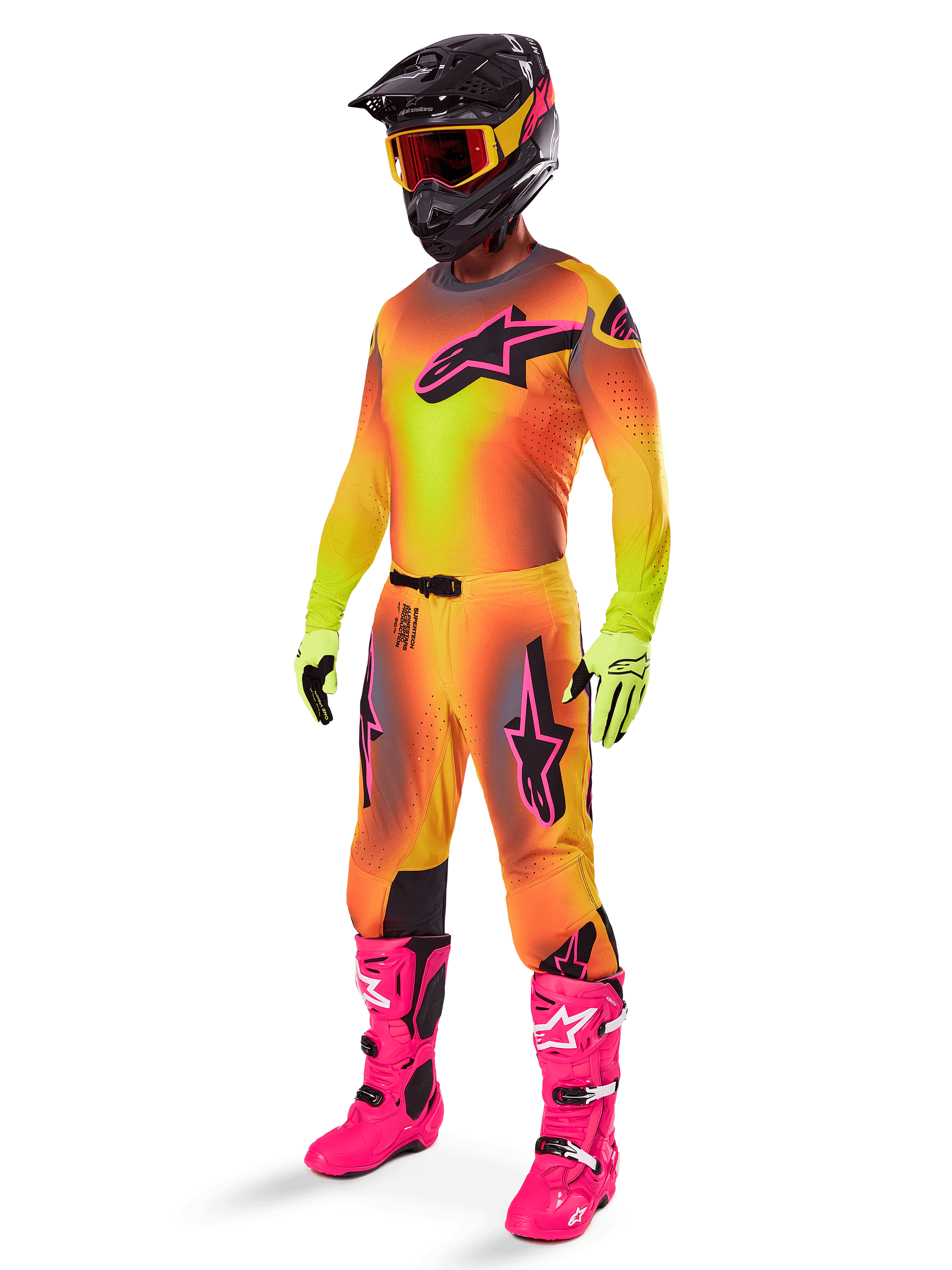 Alpinestars 2025 Supertech Lipan Pants, Motocross Pants, Yellow and Pink, worn as part of a full gear set with matching gradient jersey, bright pink boots, yellow gloves, and black helmet, featuring bold black logos and athletic fit for off-road racing