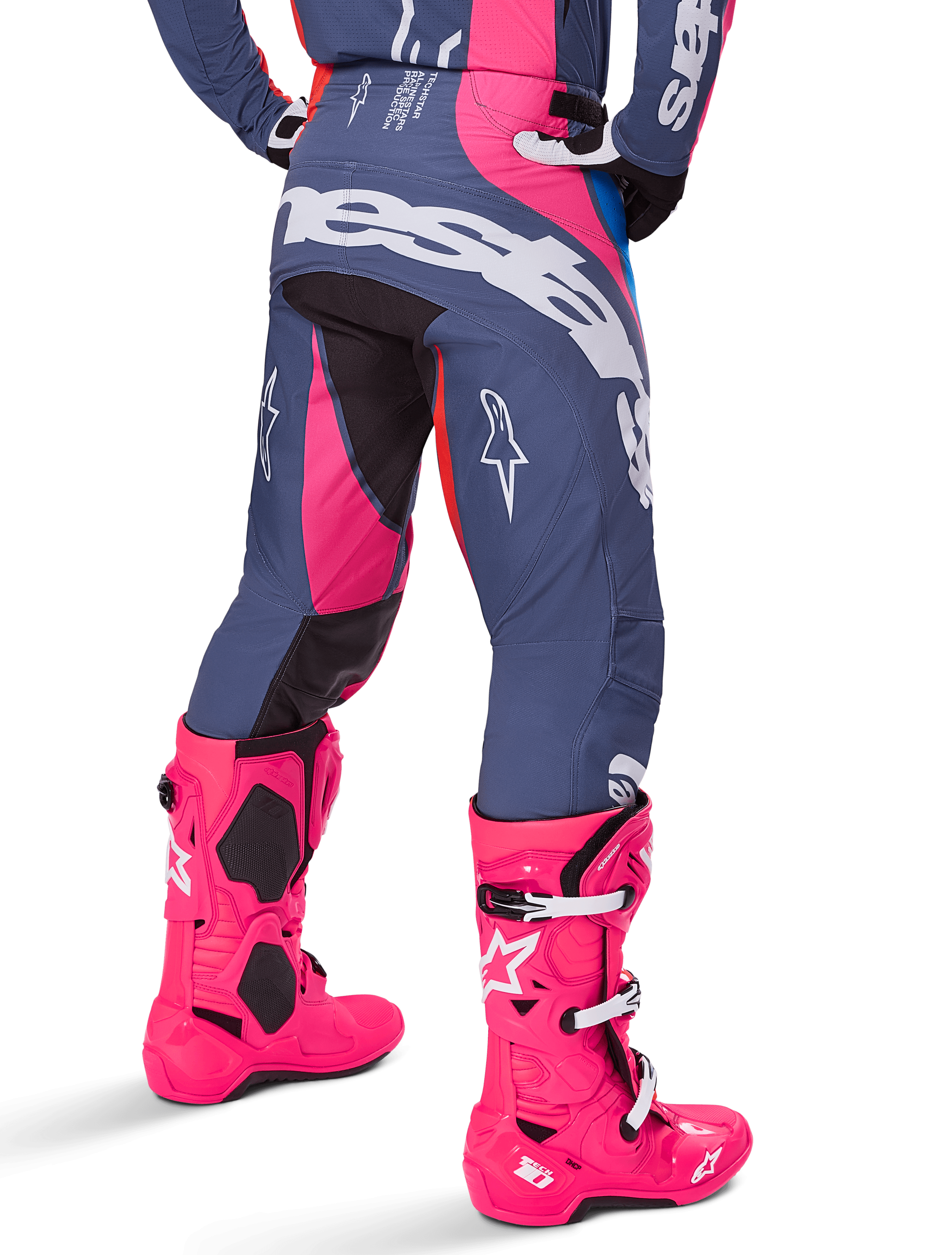 Alpinestars 2025 Techstar Dreem Pants, Motocross Pants, Gray and Bright Pink, worn with matching pink boots, featuring large white Alpinestars branding on the seat and star logos on the legs, durable athletic race fit for off-road performance