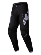 Alpinestars 2025 Racer Graphite Pants, Motocross Pants, Black and Gray, featuring large gray Alpinestars logos on the thighs, pre-curved leg design, and a magnetic waist buckle for off-road racing performance