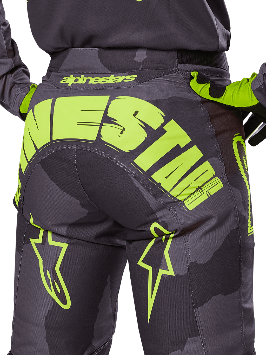 Alpinestars 2025 Racer Hollow Pants, Motocross Pants, Dark Camo and Yellow Fluo, featuring a large yellow Alpinestars logo across the rear, tactical camo pattern with bright yellow accents, and durable construction for off-road racing.