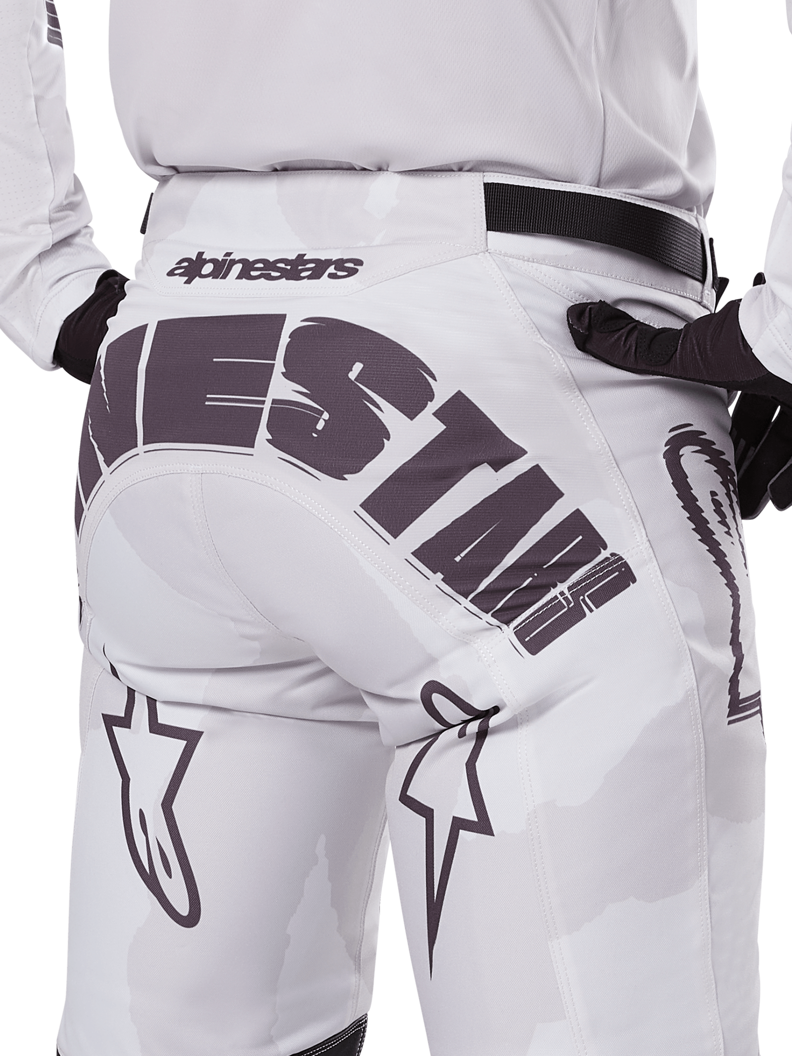 Alpinestars 2025 Racer Hollow Pants, Motocross Pants, Light Camo Brown, close-up back view featuring large Alpinestars branding across the seat, star logos on the legs, and a black adjustable waist strap, designed for off-road racing