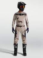 Alpinestars Men's Racer Lone Gear Set, tan desert camo motocross jersey and pants on model with black helmet and boots.