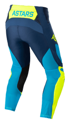 Alpinestars Techstar Factory Pants, Motocross Pants, Dark Blue, Yellow Fluo, and Bright Blue Neo, rear view featuring 'ASTARS' branding on the waistband, perforated mesh panels for cooling, black inner leg patches, and a pre-curved race fit for off-road performance.