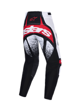 Alpinestars 2026 Techstar Nomur Pants, Motocross Pants, Black White and Red, rear view featuring bold red and white branding across the seat, black and white speckled patterns on the thighs, and multi-panel performance construction.