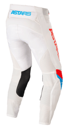 Alpinestars Techstar Quadro Pants, Motocross Pants, Off White Blue Neon Bright Red, rear view showing light blue 'ASTARS' logo on the waistband, mesh ventilation panels, black leather inner leg patch, and bold red branding on the side.