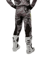 Alpinestars 2024 Racer Tactical Pants, Motocross Pants, Cast Gray Camo Magnet, rear view showing camouflage pattern and black breathable stretch zones, worn with white and black motocross boots, designed for off-road racing.
