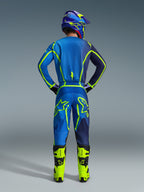 Alpinestars 2026 Fluid Apex Pants, Motocross Pants, Blue and Yellow Fluo, back view of rider in full racing gear, matching jersey and helmet, bright yellow boots, coordinated athletic fit for motocross.