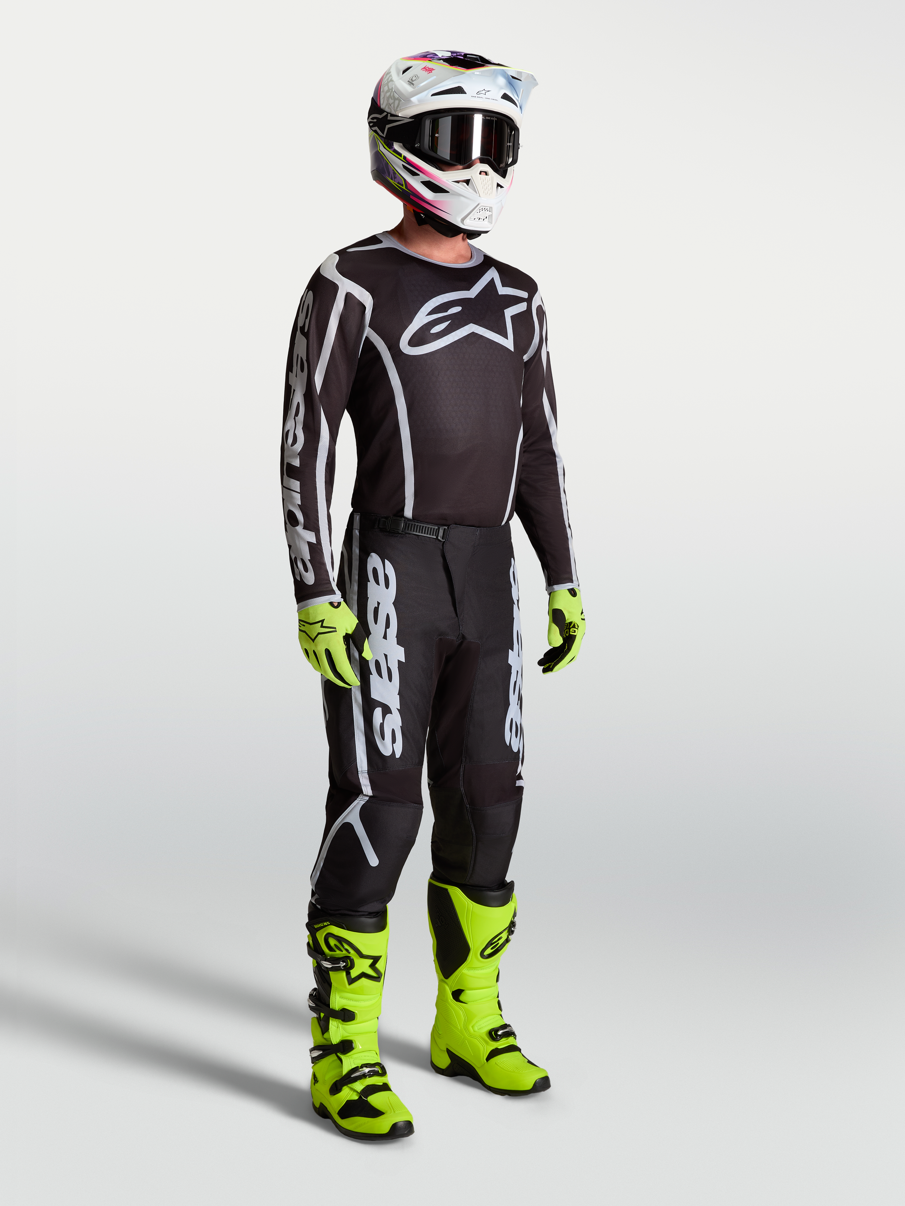 Alpinestars Fluid Apex V2 Pants, black and silver motocross pants for men, durable synthetic gear for off-road riding.
