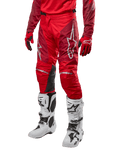 Alpinestars 2024 Racer Hoen Pants, Motocross Pants, Mars Red and Burgundy, worn with matching red jersey and gloves and white boots, featuring black leather knee panels and white logos, durable technical gear for off-road racing