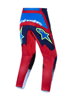 Alpinestars 2027 Fluid Drag Motocross Pants in red and blue featuring bold yellow graphics and reinforced seat construction.