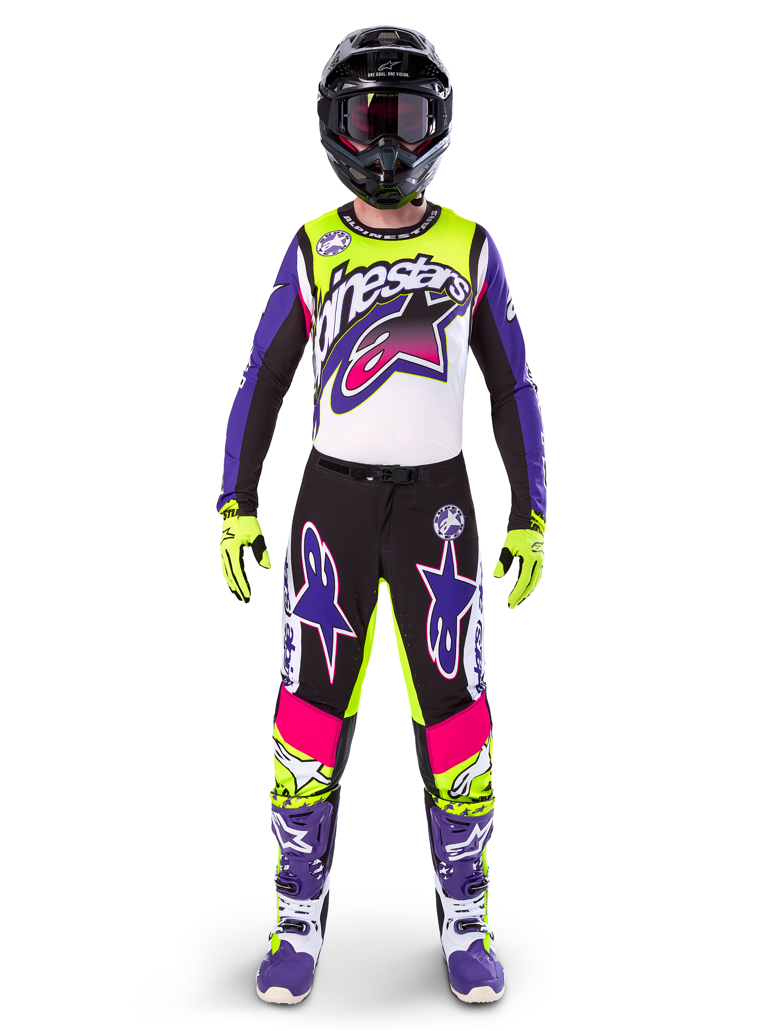 Motocross rider wearing complete racing gear, Limited Edition Supertech Dirt Studios jersey and pants in white, purple, and yellow fluo, black helmet with goggles, purple and white boots, coordinated vibrant outfit for off-road motocross racing