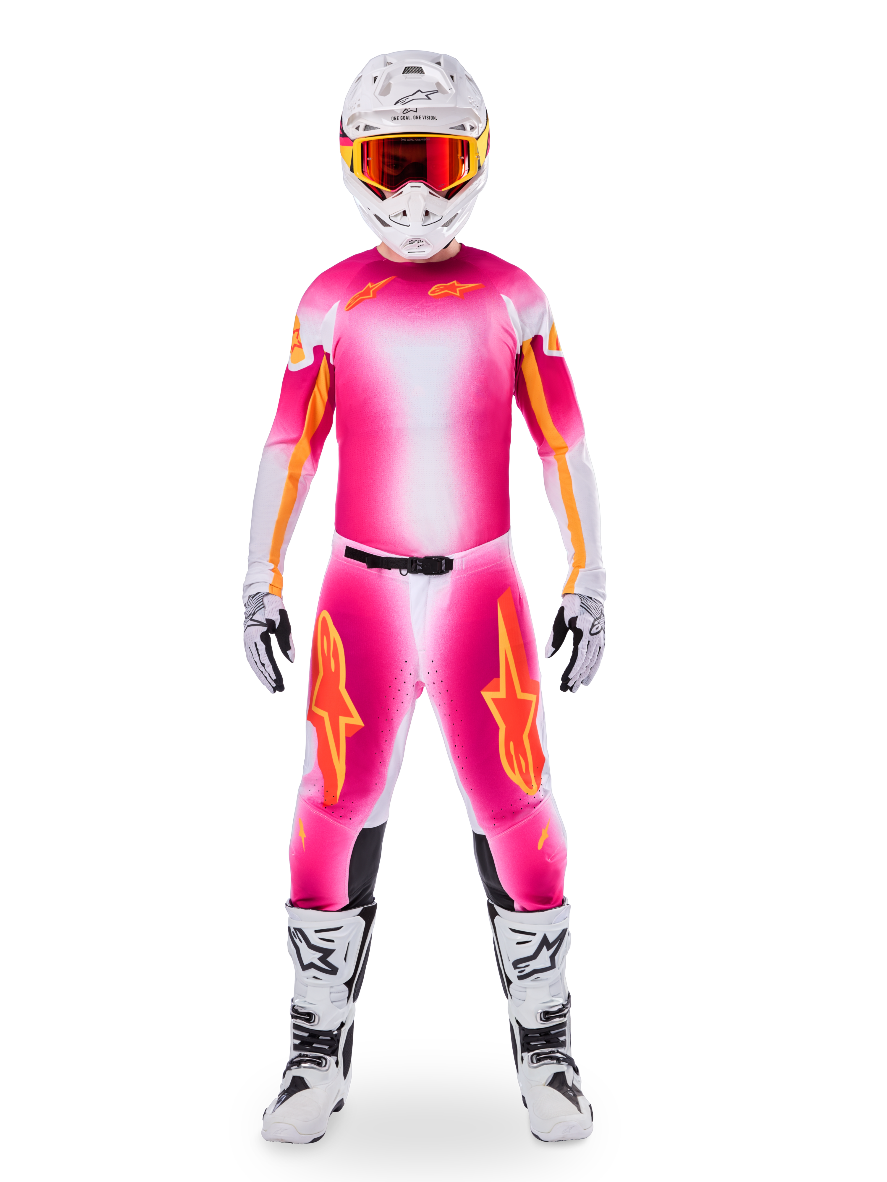 Motocross rider wearing Alpinestars Limited Edition Supertech AFD MIG Gear Set, vibrant Pink Fluo and White gradient jersey and pants with orange logos, white helmet with red goggles, white and black boots and gloves, coordinated professional racing outfit.