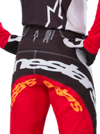 Alpinestars Limited Edition Techstar Deep Pants, Motocross Pants, Black White and High Red, featuring a multi-panel design, reinforced knees, and 4-way stretch panels for off-road performance.