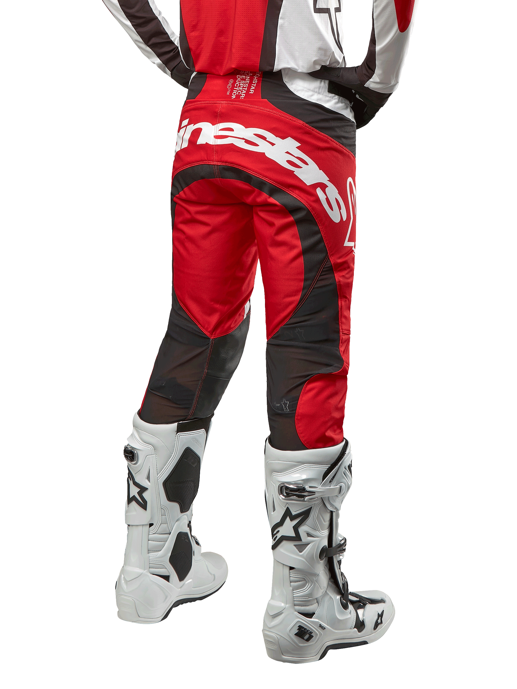 Alpinestars 2024 Techstar Ocuri Pants, Motocross Pants, Mars Red White and Black, back view featuring large white Alpinestars logo on the seat, black mesh ventilation panels, worn with white and black motocross boots, athletic race-fit design for off-road riding