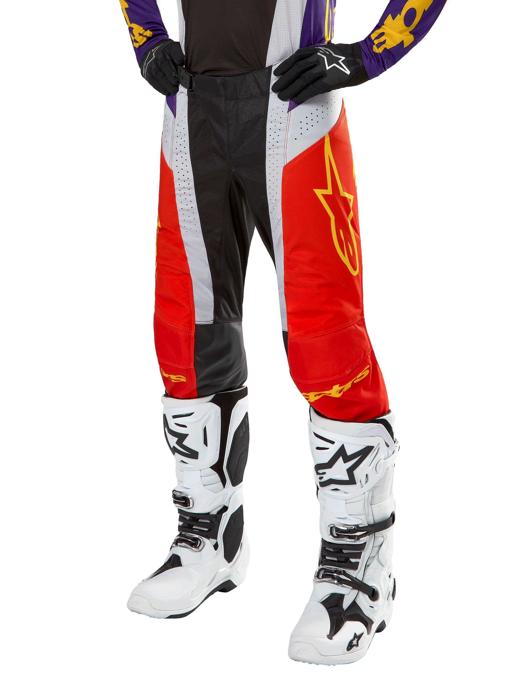 Alpinestars 2024 Techstar Ocuri Pants, Motocross Racing Pants, Hot Orange, Black, and White with Yellow Star Graphic, worn with purple jersey and white boots, durable performance gear for off-road competition