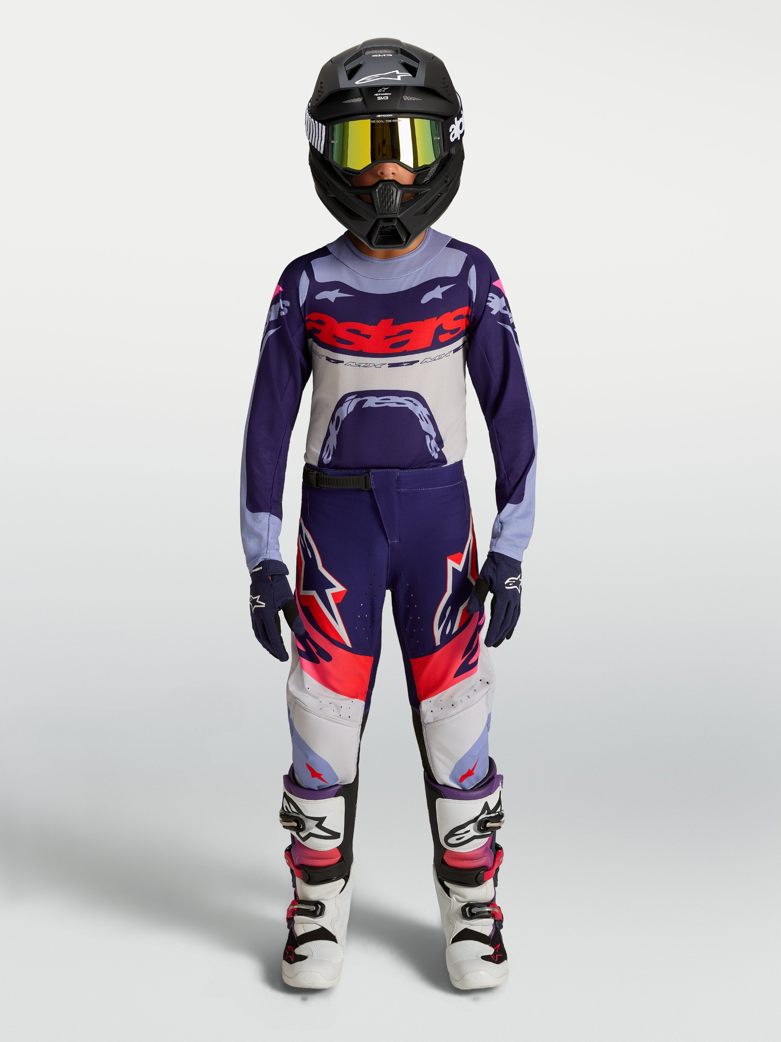 Alpinestars Youth Supertech Dyna Motocross Pants, purple and pink fluo gear set shown on-model for off-road racing.