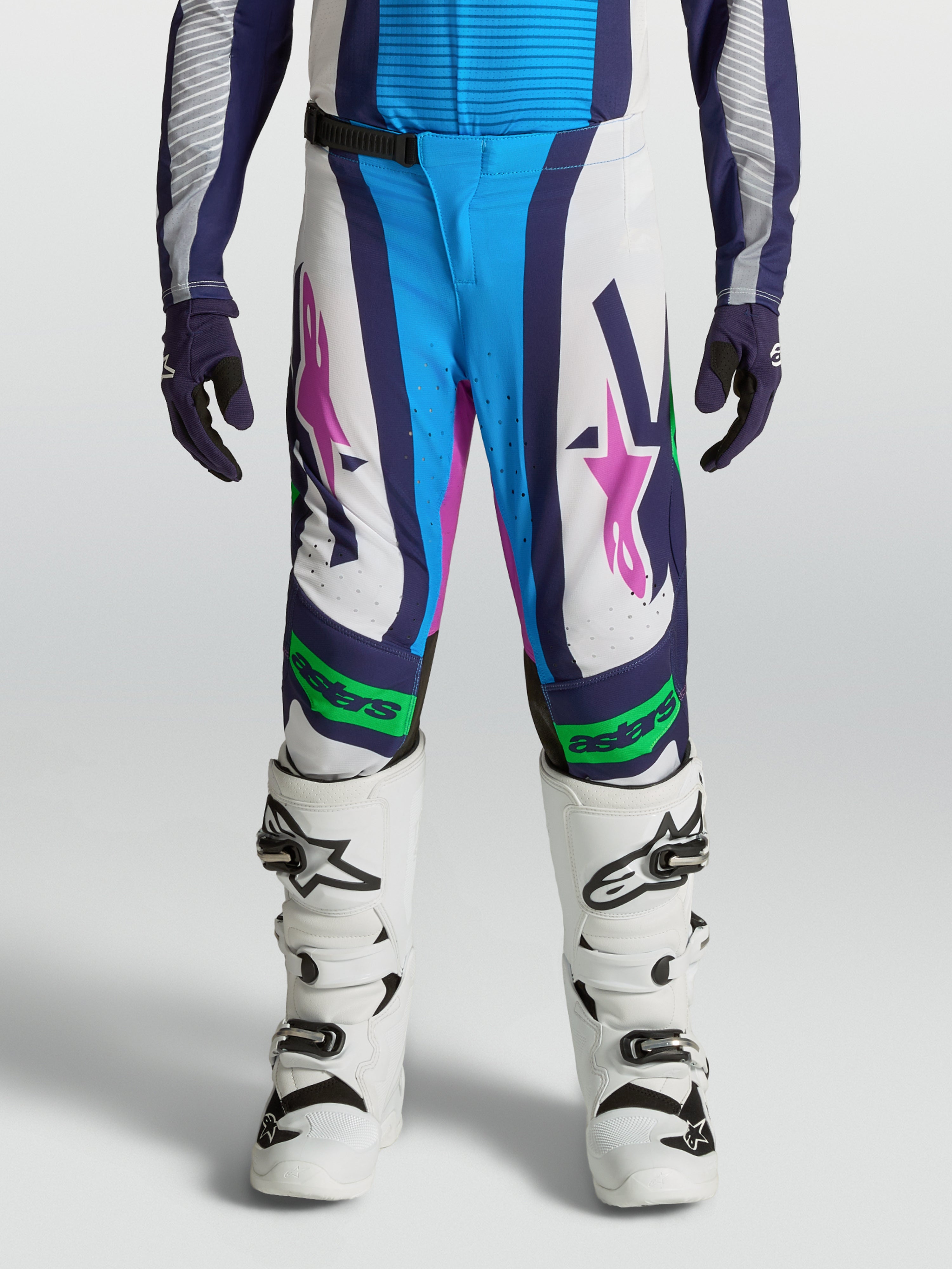 Alpinestars Youth Supertech Maven Pants, white and blue motocross gear with fluo green accents and athletic performance fit.