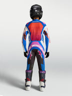 Alpinestars Youth Supertech Maven Pants, Blue and Hot Coral Motocross Gear, Athletic Race Fit, Rear View on Young Rider.