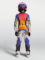 Alpinestars Youth Fluid Drag Pants, blue and white youth motocross pants with yellow accents for durable off-road performance.