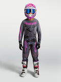 Alpinestars 2027 Youth Fluid Lone Gear Set, youth motocross racing outfit in gray and pink camo with jersey, pants, and helmet.
