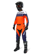 Motocross rider wearing the Alpinestars Pro-Dura Jersey in Navy, Hot Orange, and White, coordinating off-road pants, black helmet with goggles, and black boots, complete professional gear set for enduro and trail riding.