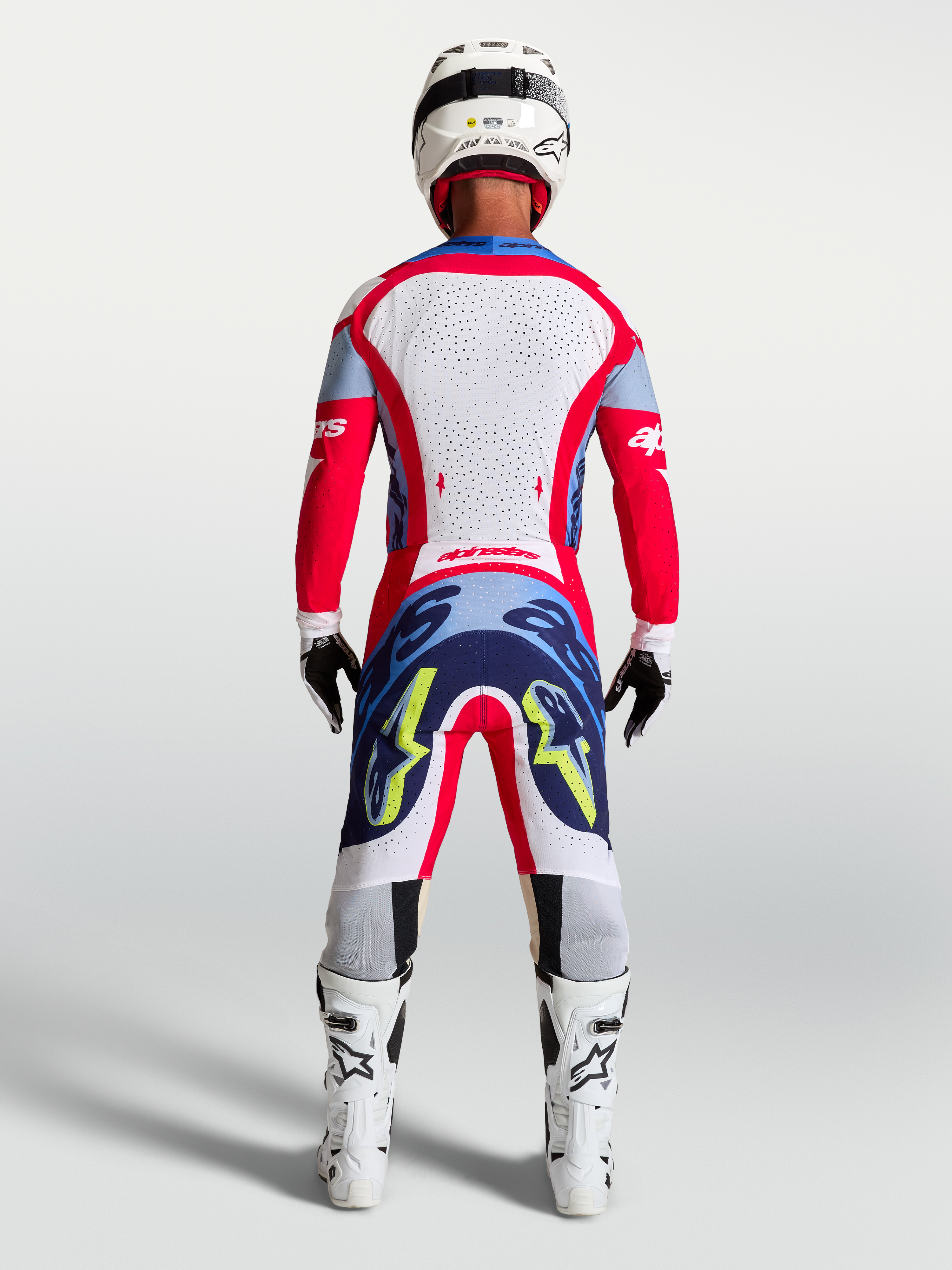 Alpinestars Supertech Dyna Jersey AND 2027 Supertech Dyna Gear Set, Men's Motocross Outfit in Fire Red and White, rear view.