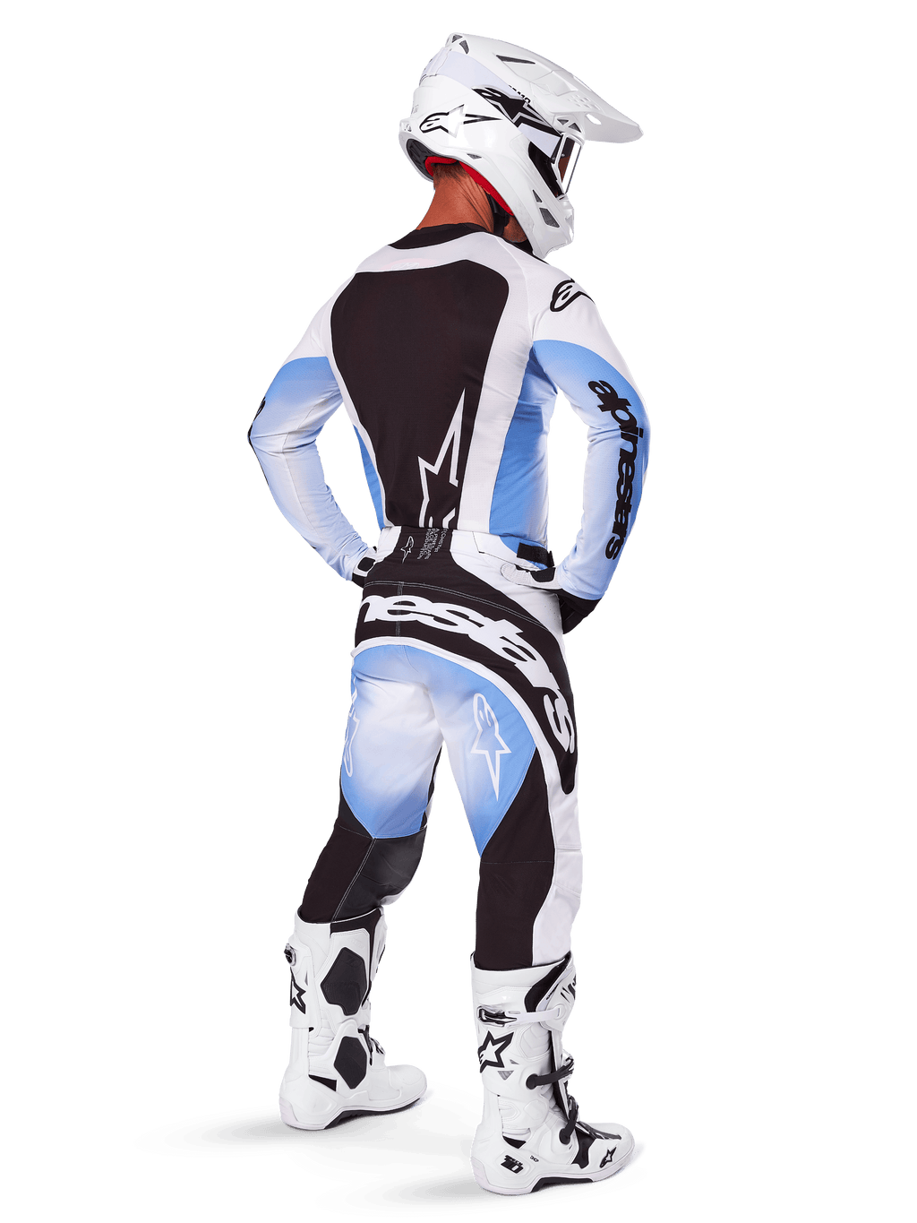Motocross rider wearing complete racing gear, 2025 Techstar Melt Gear Set, White and Light Blue jersey with black back panel, matching pants with blue gradient and black accents, white helmet, white and black boots, coordinated outfit for off-road racing