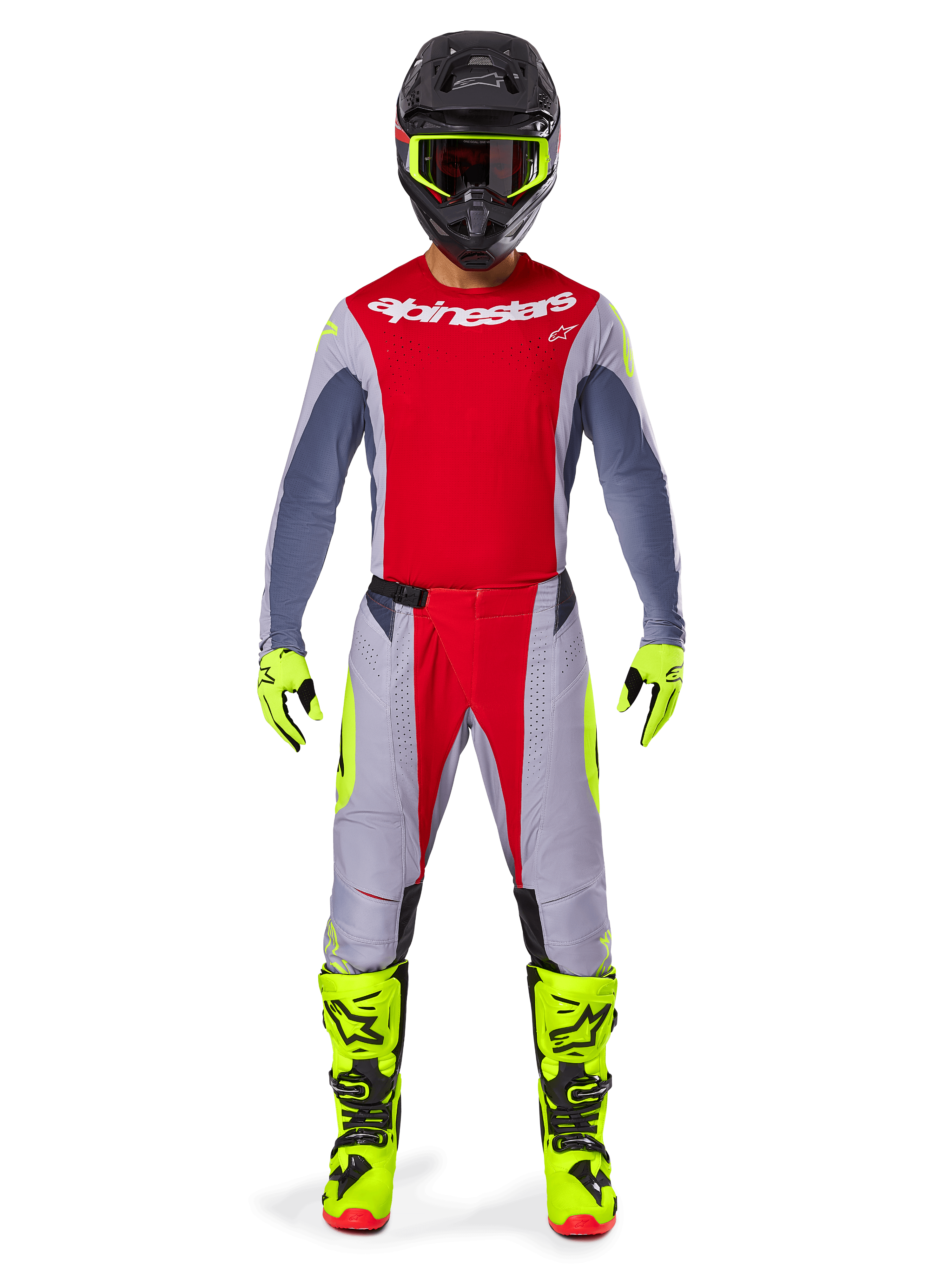 Motocross rider wearing the Alpinestars 2025 Techstar Melt Gear Set, red jersey with gray sleeves and white logo, matching gray and red pants, fluo-yellow goggles, gloves, and boots, complete motocross racing outfit for off-road performance.