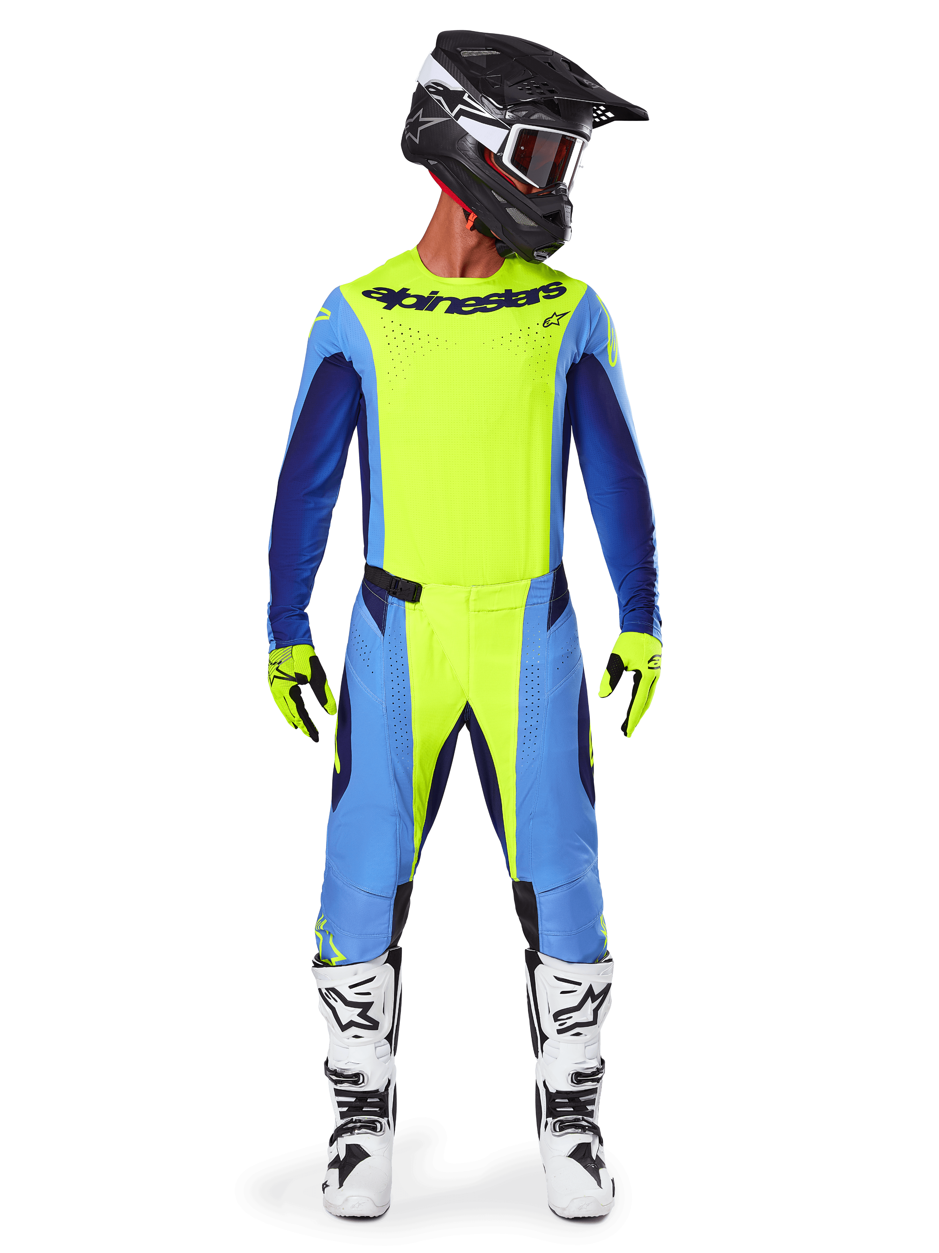 Motocross rider wearing complete racing gear, Alpinestars 2025 Techstar Melt Jersey in Yellow Fluo and Blue, matching yellow and blue motocross pants, black helmet with white graphics and goggles, white and black boots, yellow and black gloves, coordinated performance outfit for off-road racing
