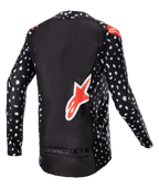 Alpinestars 2023 Supertech North Jersey, Motocross Jersey, Black with white speckled pattern and Neon Red accents, back view featuring large red Alpinestars logo and bottom branding, professional-level off-road racing gear.