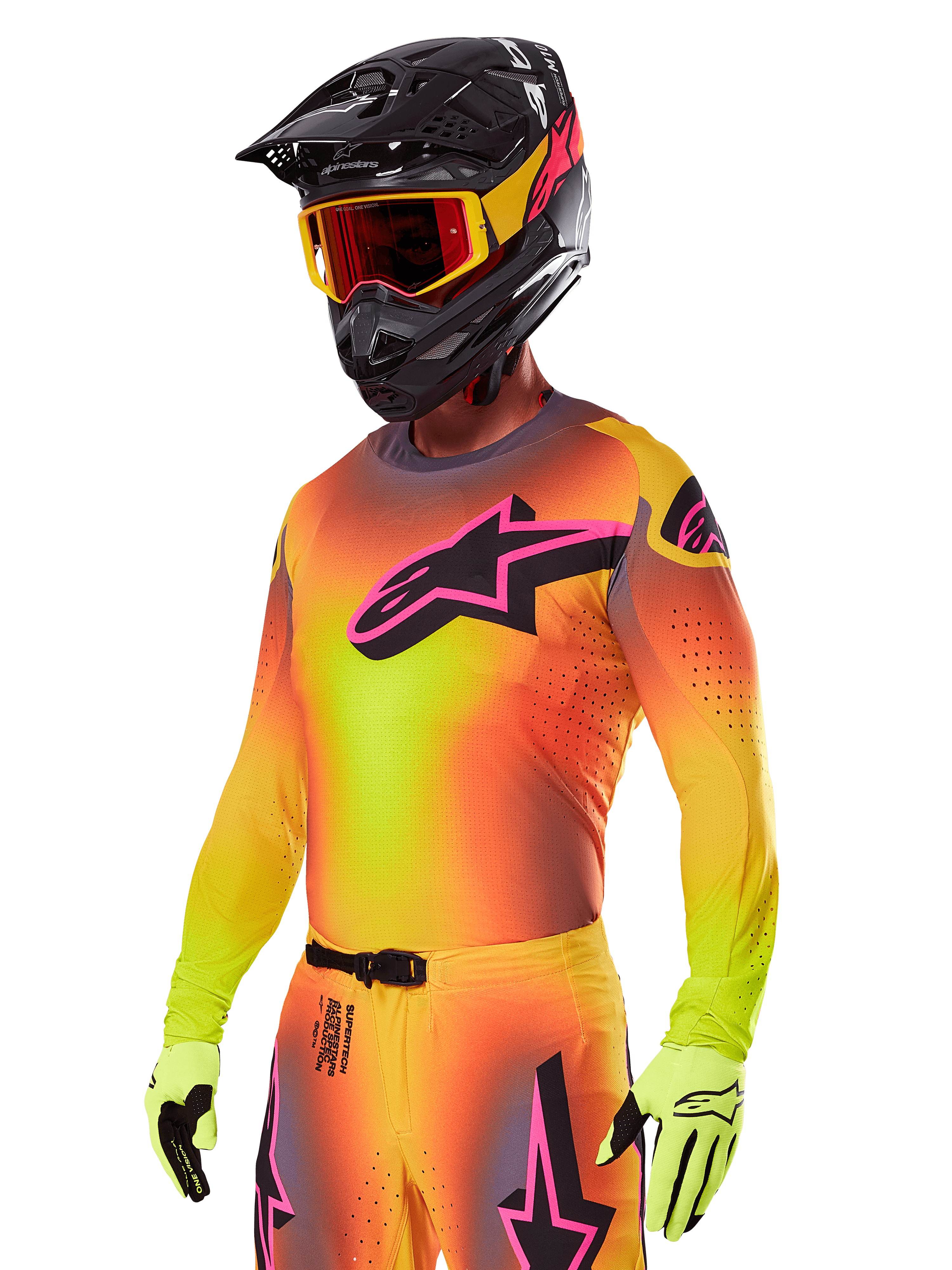 Motocross rider wearing the Alpinestars 2025 Supertech Lipan Gear Set, featuring a yellow and orange gradient jersey with a pink and black Astars logo, neon yellow gloves, and a black helmet with red goggles, professional off-road racing gear.