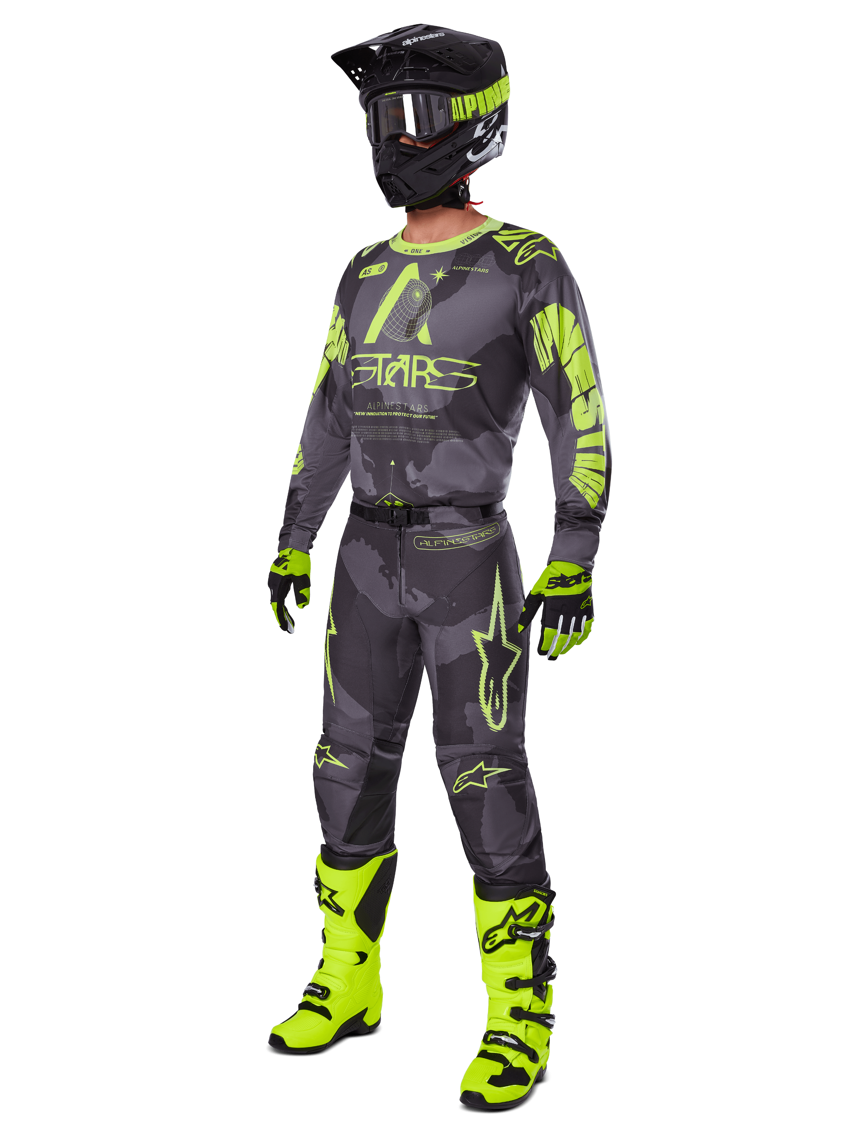 Motocross rider wearing the Alpinestars 2025 Racer Hollow gear set, Dark Camo and Yellow Fluo jersey and pants, black and fluo yellow helmet, matching gloves, and bright fluo yellow boots, coordinated outfit for off-road racing