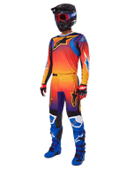 2025 Fluid Wurx Gear Set, Motocross Jersey and Pants with Orange Red Purple gradient and Blue Yellow star designs, worn with a Black helmet, red goggles, Red and Black gloves, and Blue boots, high-visibility racing gear