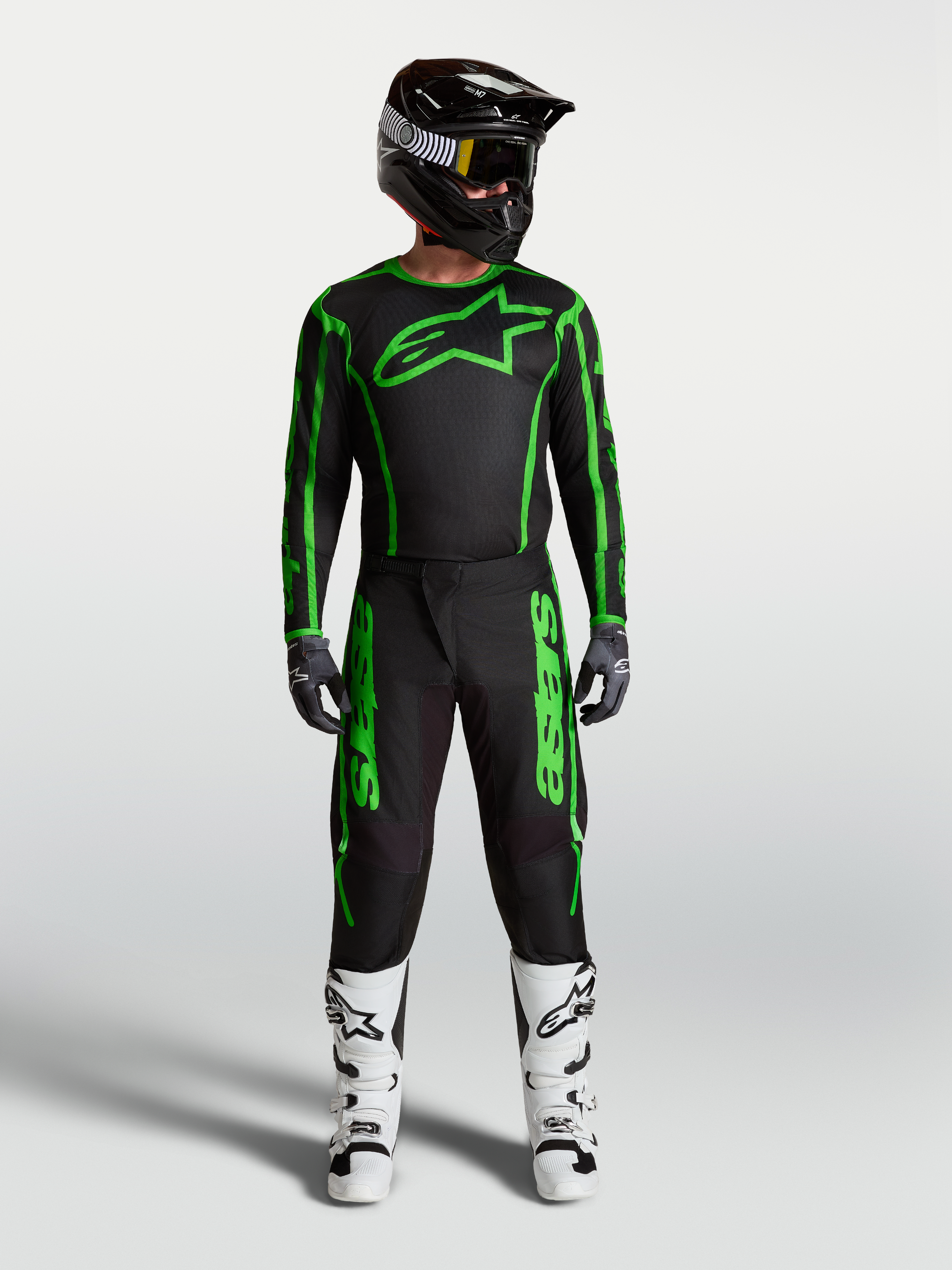 Alpinestars Fluid Apex V2 Pants, Men's Motocross Gear, Black and Green Fluo, full racing outfit with white boots.