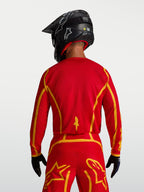 Alpinestars Fluid Apex V2 Jersey, Fire Red and Gold men's motocross gear, rear view with ergonomic cut and breathable fabric.
