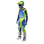 Alpinestars 2024 Racer Hoen Jersey, Motocross Jersey, Yellow Fluo and Blue Night Navy, worn by a rider with matching pants, helmet, and white boots, professional racing gear for off-road riding