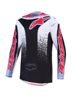 Alpinestars Fluid Drag Jersey, black and white motocross top with red fluo graphics and moisture-wicking textile fabric.