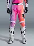 Alpinestars 2026 Racer Air Portl Pants, Motocross Pants, vibrant purple pink and orange gradient, featuring bold star logos on the thighs, worn with white racing boots and black gloves, designed for high-performance off-road riding.