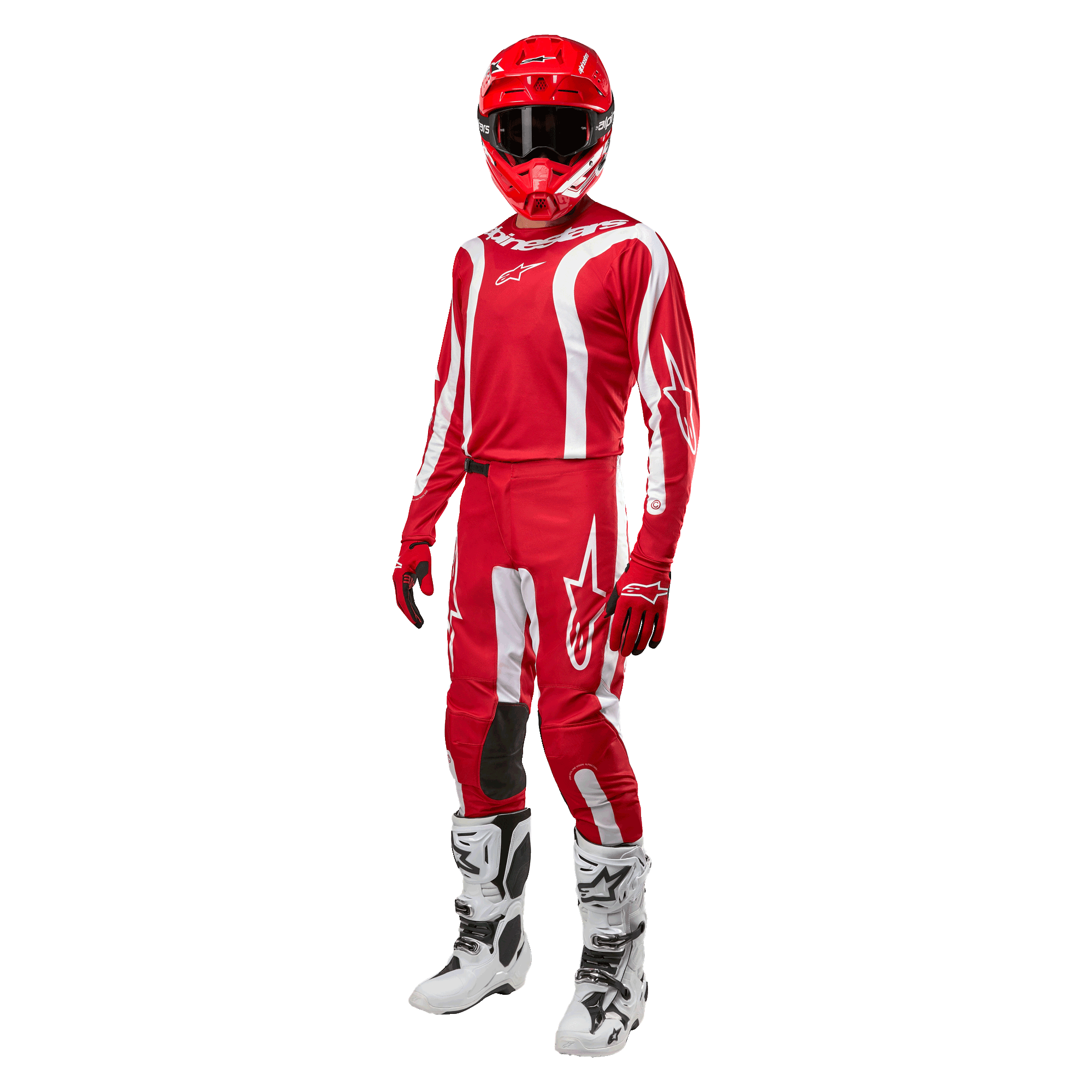 Motocross rider wearing complete racing gear, Alpinestars 2024 Fluid Lurv Jersey in Mars Red and White, matching red pants with white accents, red helmet, red gloves, and white and black boots, coordinated outfit for off-road racing