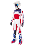 Alpinestars Limited Edition Techstar Fortitude Gear Set, Motocross Outfit, Red White and Blue, featuring a white jersey with bold graphics, matching race pants, white helmet with goggles, and coordinated blue and red boots, professional racing gear for off-road performance