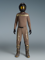 Limited Edition Supertech Air Gold Gear Set, tan motocross outfit with metallic gold logos, matching boots and helmet.