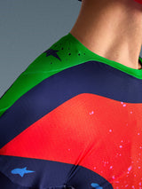 Close-up of the Alpinestars Limited Edition Supertech Records Jersey, multicolor design with green shoulder, navy and red panels, featuring laser-cut perforations and breathable mesh fabric for professional motocross performance.
