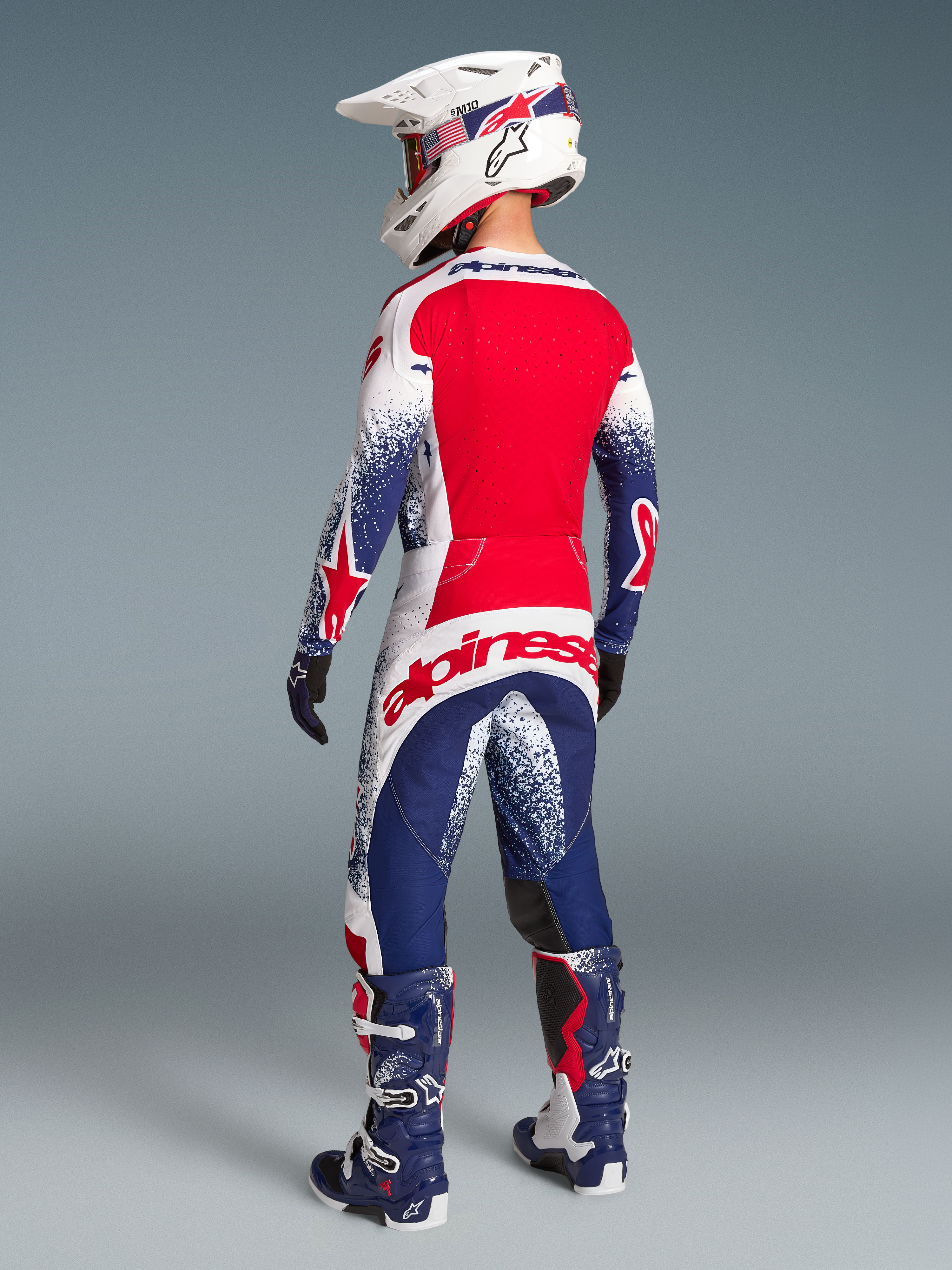 Alpinestars Limited Edition Techstar Unity Gear Set, red, white, and blue motocross kit, men's racing fit, rear view.