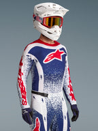 Alpinestars Limited Edition Techstar Unity Jersey, red and blue splatter design, on-model for men's motocross racing.
