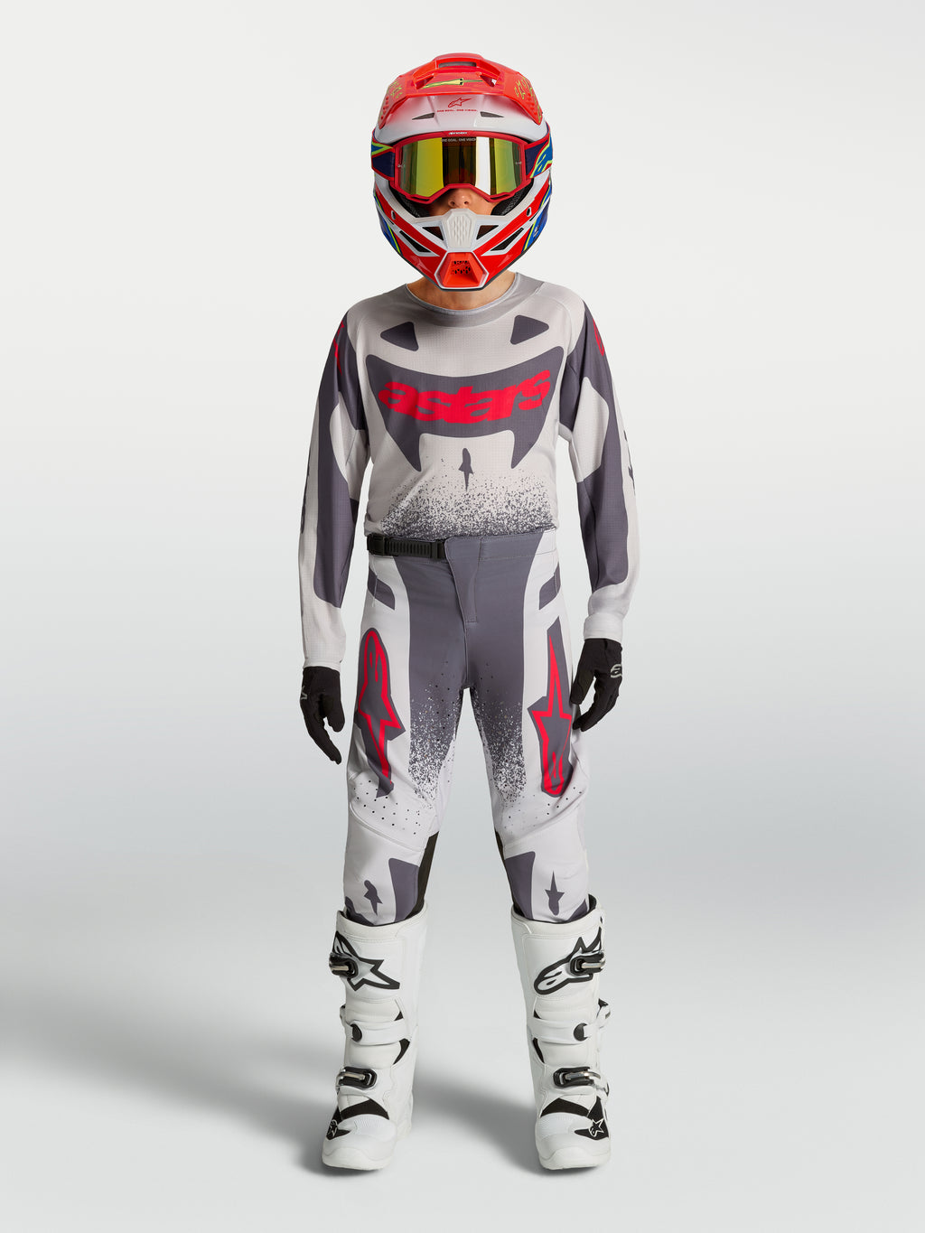 Alpinestars 2027 Youth Supertech Swan Jersey and Gear Set, gray and white motocross racing outfit with red accents.