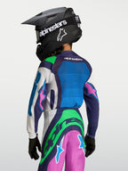 Alpinestars Youth Supertech Maven Jersey, blue and green motocross gear for young riders, rear view wearing a helmet.