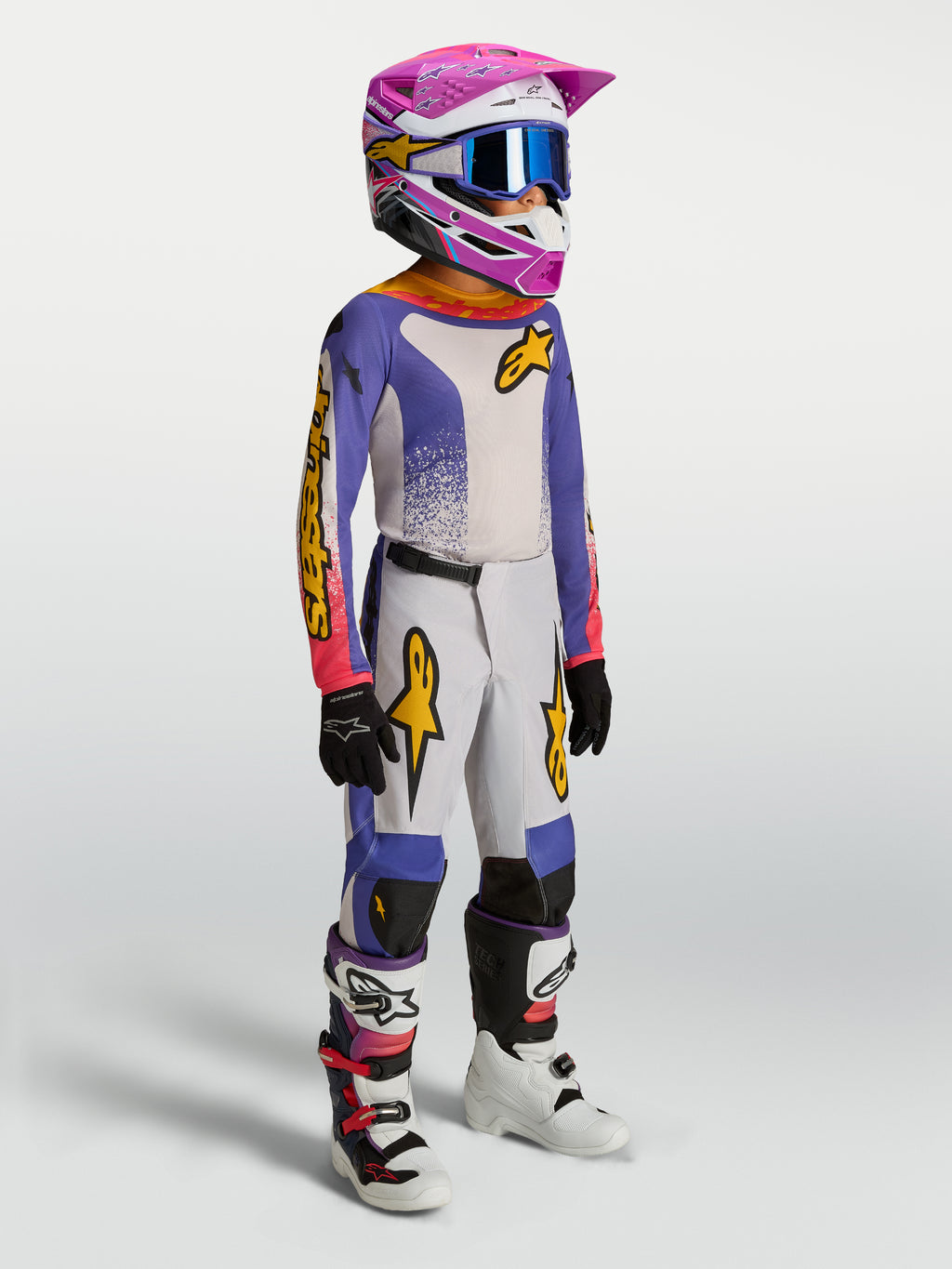 Alpinestars Youth Fluid Drag Gear Set, youth motocross racing outfit, blue and white with pink and gold accents.