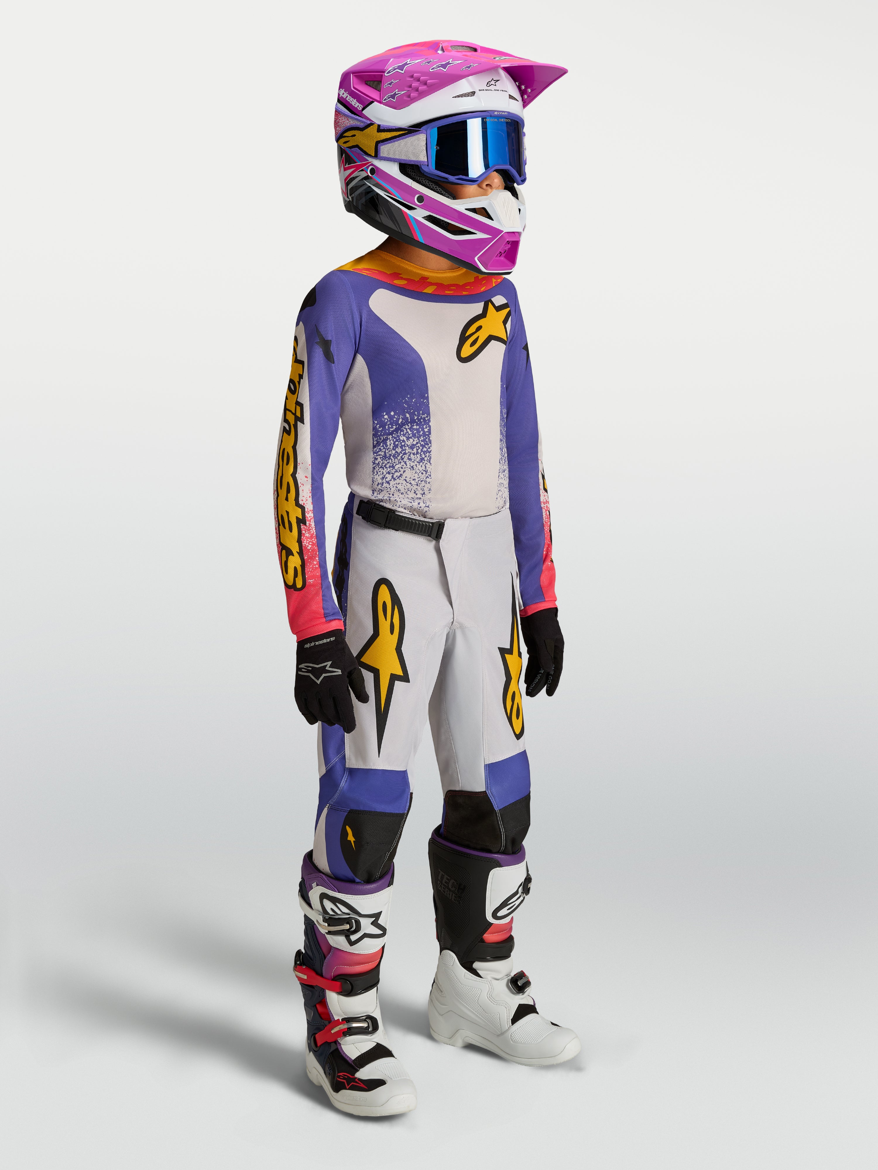 Alpinestars Youth Fluid Drag Gear Set, youth motocross racing outfit, blue and white with pink and gold accents.